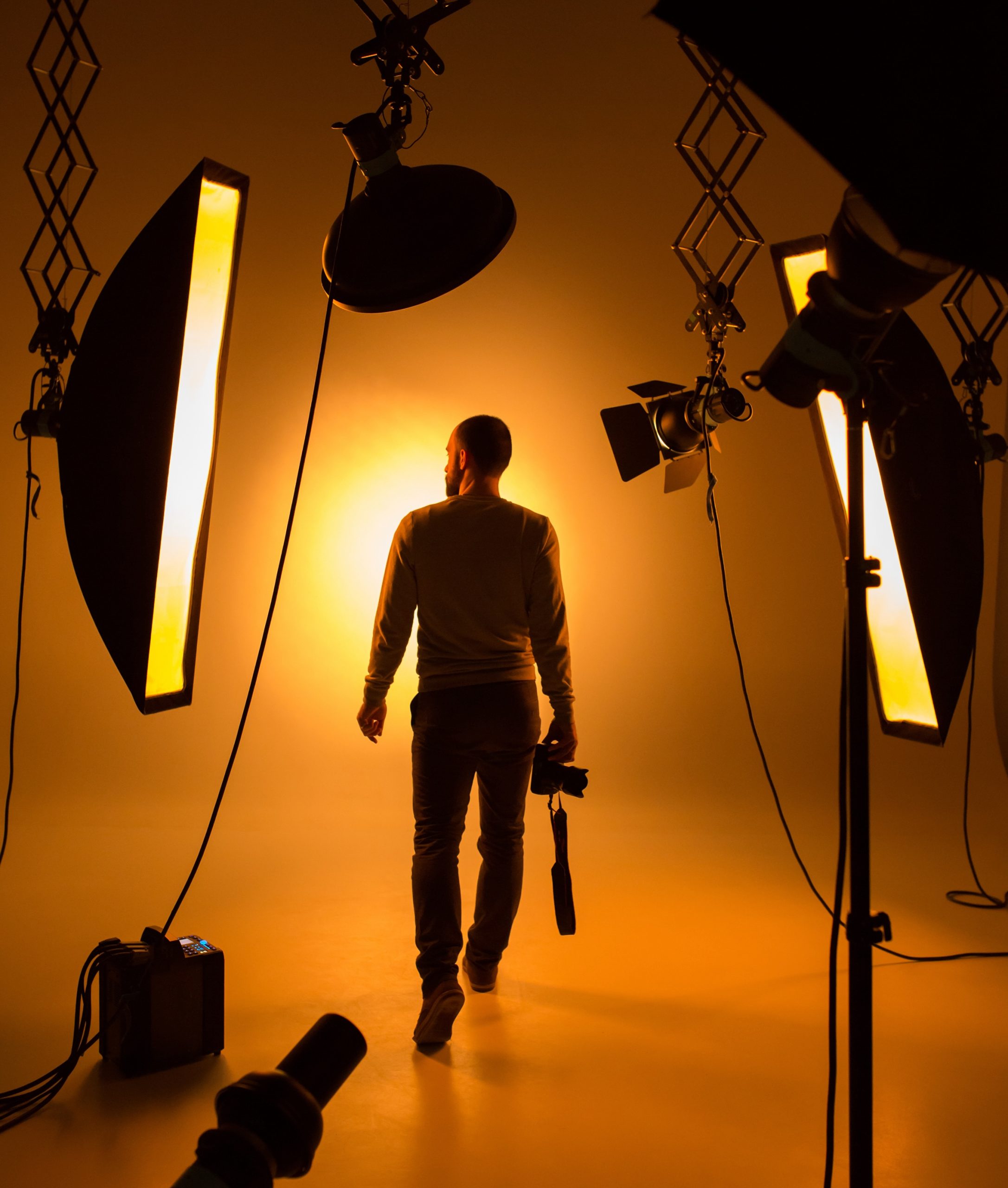 Silhouette,Of,Photographer,And,Studio,Shot,As,Workplace
